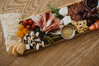 The Gift of Hosting: A Charcuterie Board to Share and a Candle to Savor.